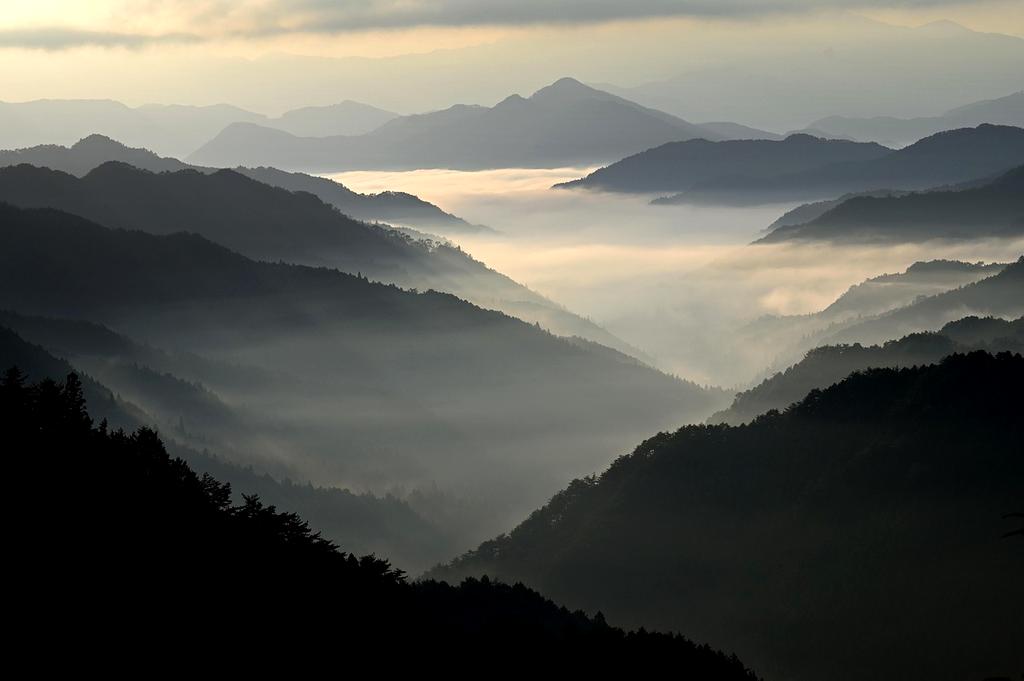 Travel packing checklist on a clipboard with travel gear