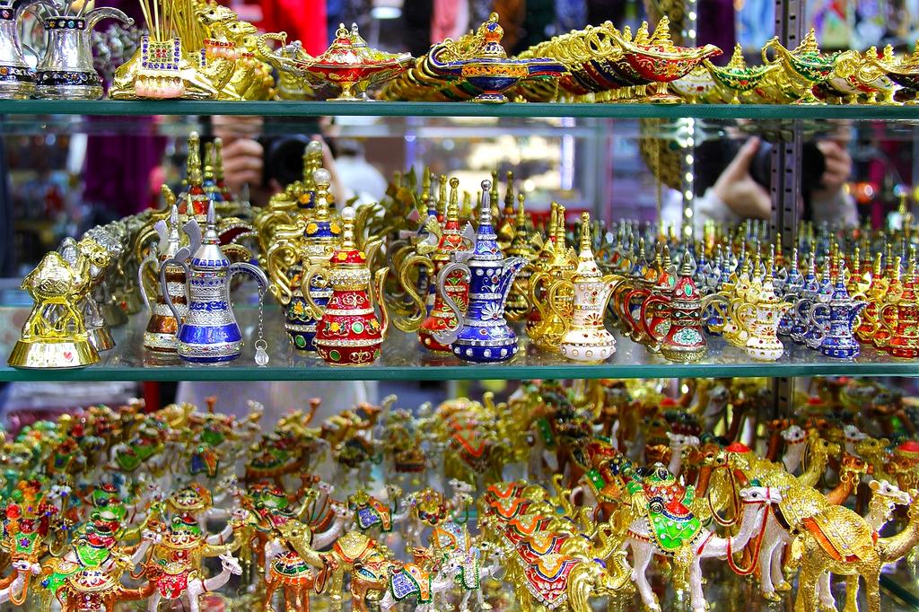 Bustling Moroccan souk with colorful textiles and traditional handicrafts