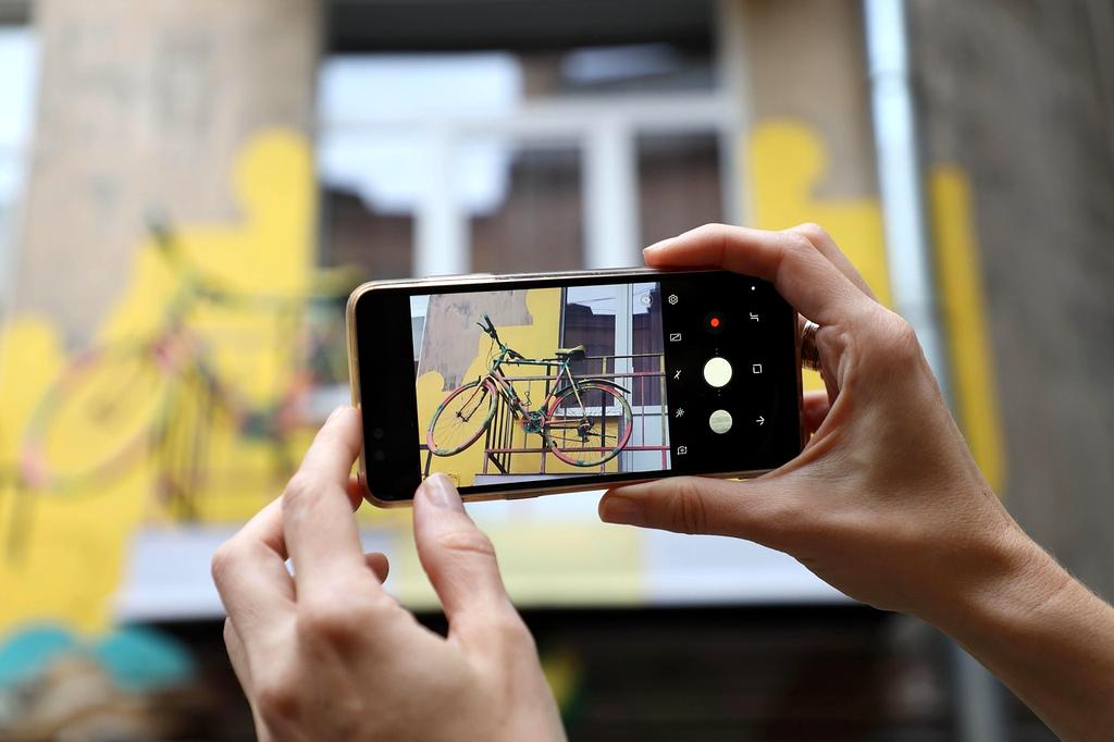 Smartphone showing travel safety app with emergency contacts